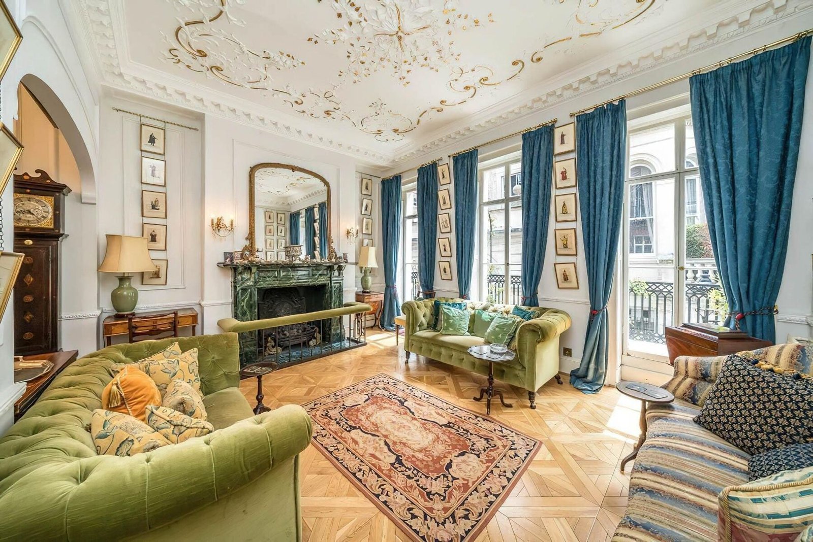 Elegant London reception room with fireplace and drapes